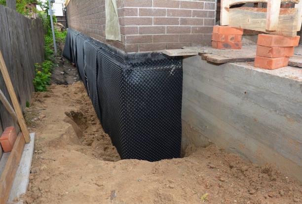 SJ Waterproofing Pros technician performing targeted Emergency Waterproofing assessment in Spiceland, IN
